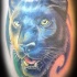 Tatuaje en color de una pantera negra.