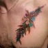 Colorful chest tattoo of little tree branch