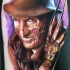 colorato Freddy Kreddy tatuaggio sulla gamba