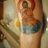Tatuaje en el antebrazo, buda en loto azul
