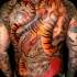 colorato tigre con serpente tatuaggio sulla schiena in stile asiatico