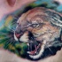 Tatuaje  de jaguar salvaje en el pecho