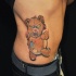 Cool bear shaped colorful voodoo doll tattoo on side