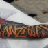 Cool colored graffiti lettering volume tattoo on arm
