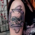 Cool colored human skull tattoo on shoulder with bicycle chain