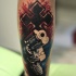Cool combined and colored arm tattoo of big pistol and cross