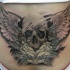 fresca idea di cranio ali tatuaggio su parte bassa della schiena
