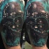 Cool illustrative style colored shoulder tattoo of Darth Vaders mask and Death Star