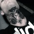 Creepy black ink cult style black ink neck tattoo of goat skull and mystic symbol