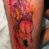 Creepy looking bloody thigh tattoo of human heart