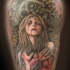 Creepy looking colored shoulder tattoo of bloody vampire woman with plants