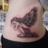 Tatuaje  de ángel triste que llora  en el estómago
