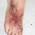 bel giglio tigre ricioli sexy tatuaggio su piede