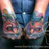 Cute illustrative style colored arms tattoo of foxes couple