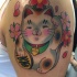 Cute old school style colored shoulder tattoo of maneki neko japanese lucky cat with pink flowers