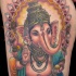 Tatuaje en el muslo, deidad ganesha