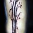 Dark black ink Asian oriental style bamboo tree tattoo on side
