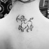 Dark black ink simple design contour Sagittarius tattoo on upper back