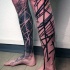 Dark black ink various ornaments tattoo on legs