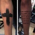 Dark black thick cross and religious lettering tattoo on both forearms