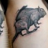 Detailed black ink tattoo of large rat