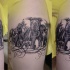 Detailed looking black ink shoulder tattoo of big elephant family