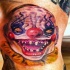 Tatuaje de payaso calvo que se ríe