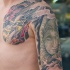 Drache und Buddha Tattoo am Arm von Graynd