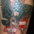 Eagle and us flag in skin rip tattoo