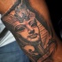Egypt style small arm tattoo of big statue