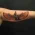 Egyptian goddess Maat colored tattoo on biceps