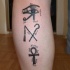 Egyptian symbols of power tattoo on leg
