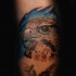 Elegant colored natural looking arm tattoo of eagle head