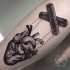 Engraving style black ink arm tattoo of human heart puppet