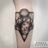 Engraving style black ink arm tattoo of astronaut with moon and triangle