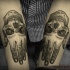 Engraving style black ink arms tattoo of humans hand with skull