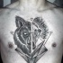 Engraving style black ink chest tattoo of terrifying wolf head with geometrical figures