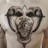 Engraving style black ink chest tattoo of human heart with elephant heads