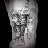 Engraving style black ink large side tattoo of puzzle picture stylized with elephant