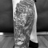 Engraving style black ink leg tattoo of Cerberus with chain