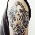 Engraving style black ink shoulder tattoo of woman with cat, rabbit and rose