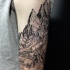 Engraving style black ink shoulder tattoo of big mountains