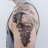 Engraving style black ink shoulder tattoo of bull with tree