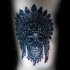 Engraving style black ink side tattoo of tribal skull with helmet