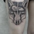 Engraving style black ink thigh tattoo of fox head with bird skull