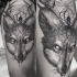 Engraving style black ink thigh tattoo of fox head with spire and horns