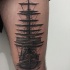 Engraving style black ink thigh tattoo of big sailing ship