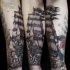 Engraving style colored arm tattoo of pirate sailing ship with flowers