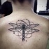 Engraving style colored back tattoo of dragonfly