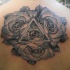 Engraving style colored back tattoo of large roses with mystical symbol